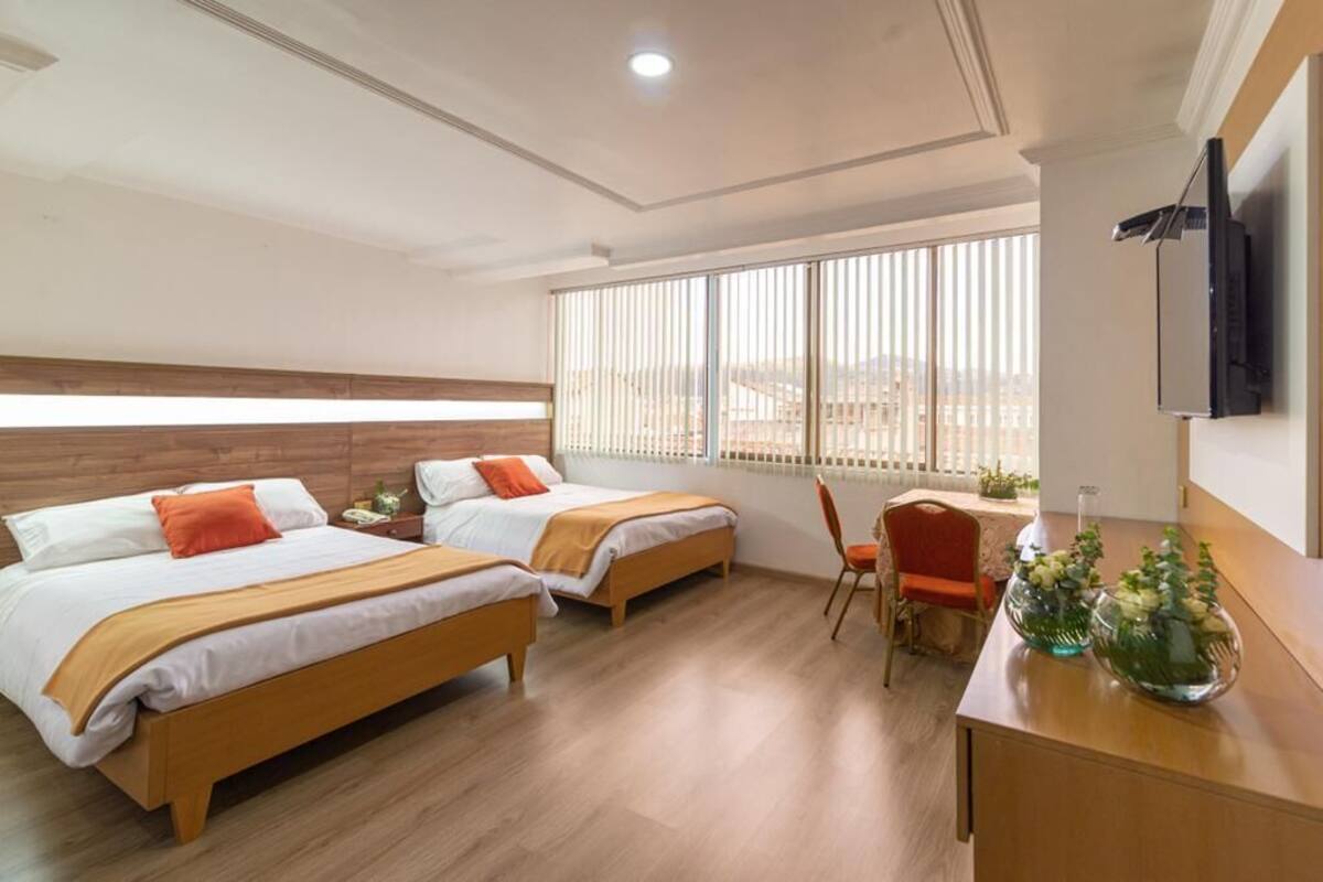 Deluxe Queen Room with Two Queen Beds | Down duvets, in-room safe, individually furnished, desk