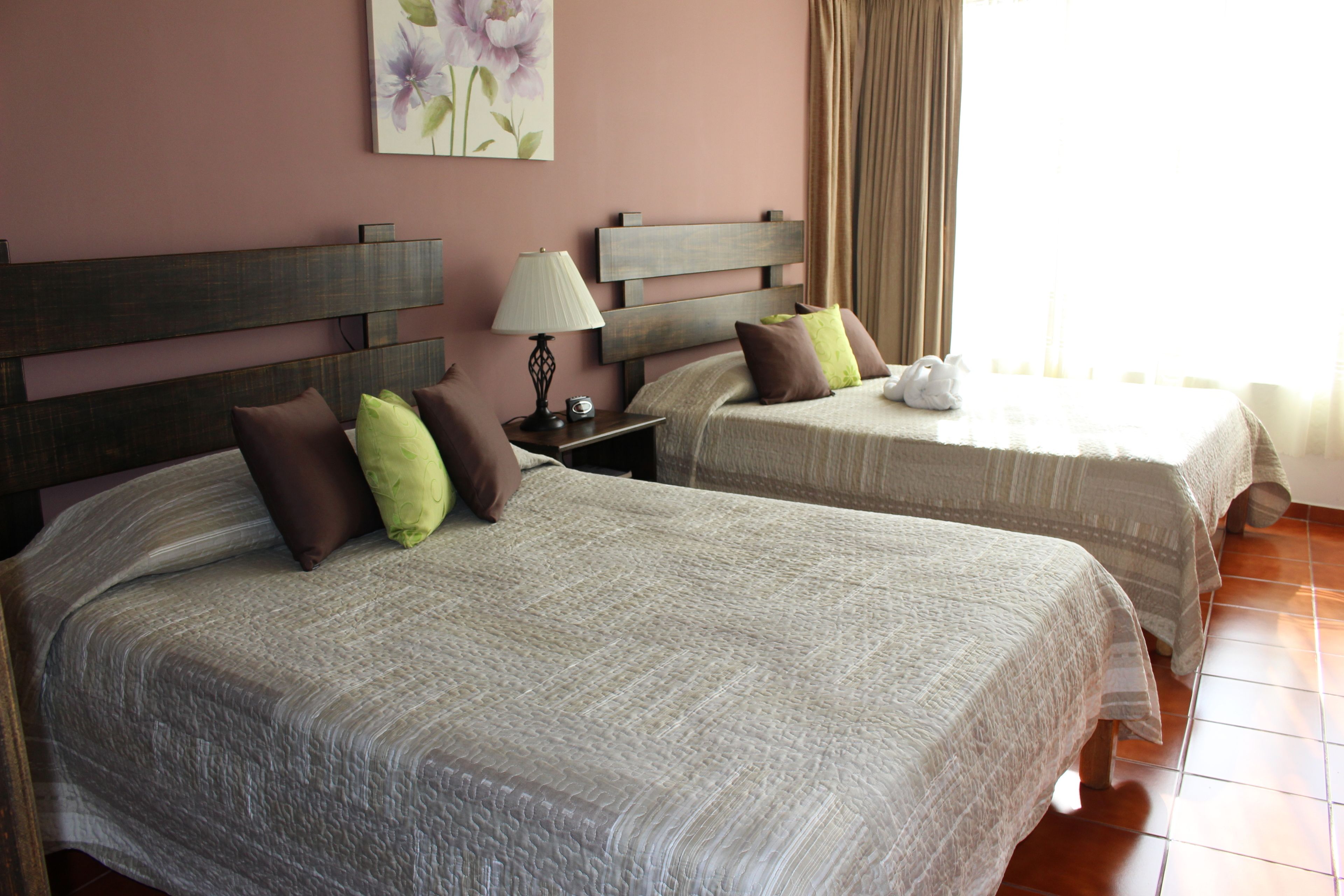 standard double room, 2 queen beds, city view | 1 bedroom, down duvets, minibar, in-room safe
