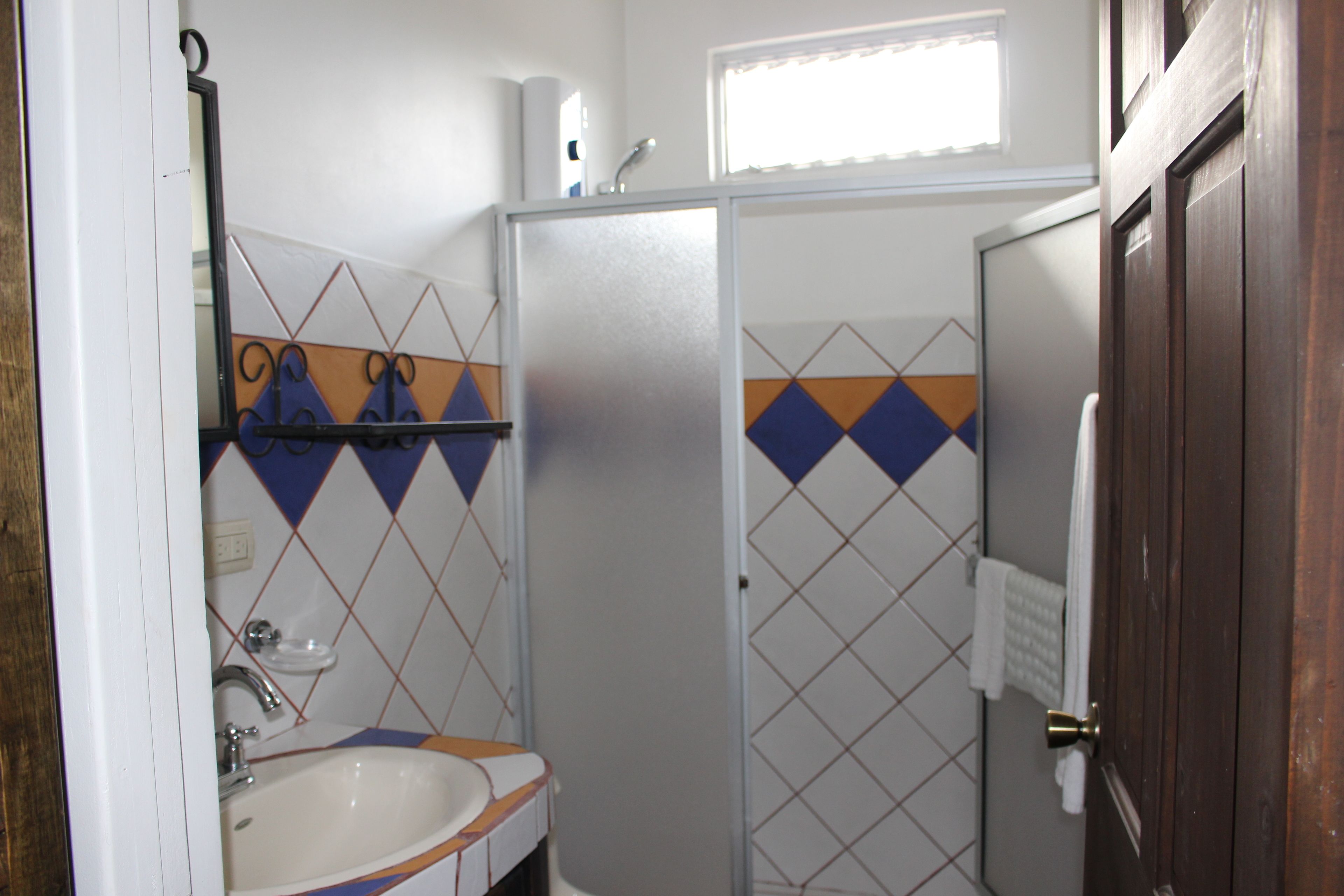 standard double room, 2 queen beds, city view | bathroom | shower, free toiletries, hair dryer, towels