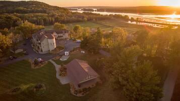 Experience the grandeur of this two-story property, set amidst beautifully manicured lawns and a serene body of water.