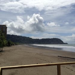 Enjoy a serene beachside retreat with access to the ocean and lush greenery.