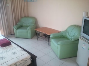 Standard Room | Living area | 40-inch LED TV with cable channels, TV - M&A Guesthouse (Hua Hin)