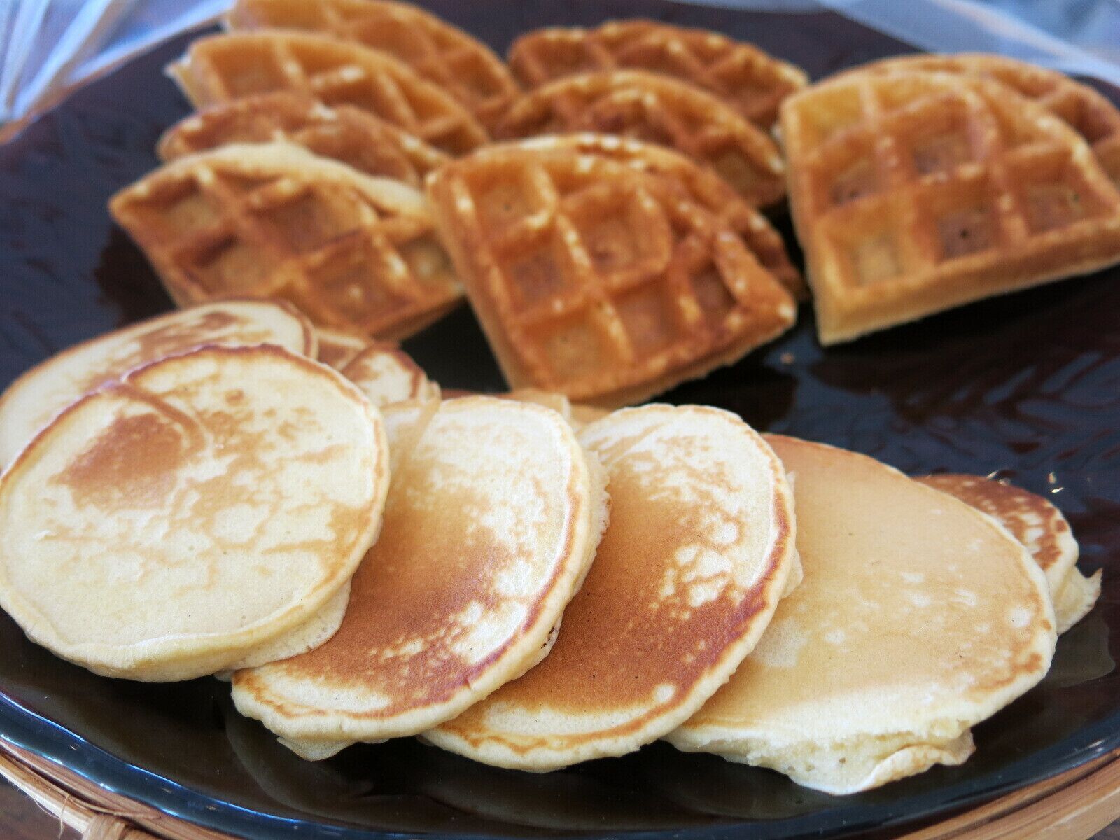 A plate with pancakes and waffles.