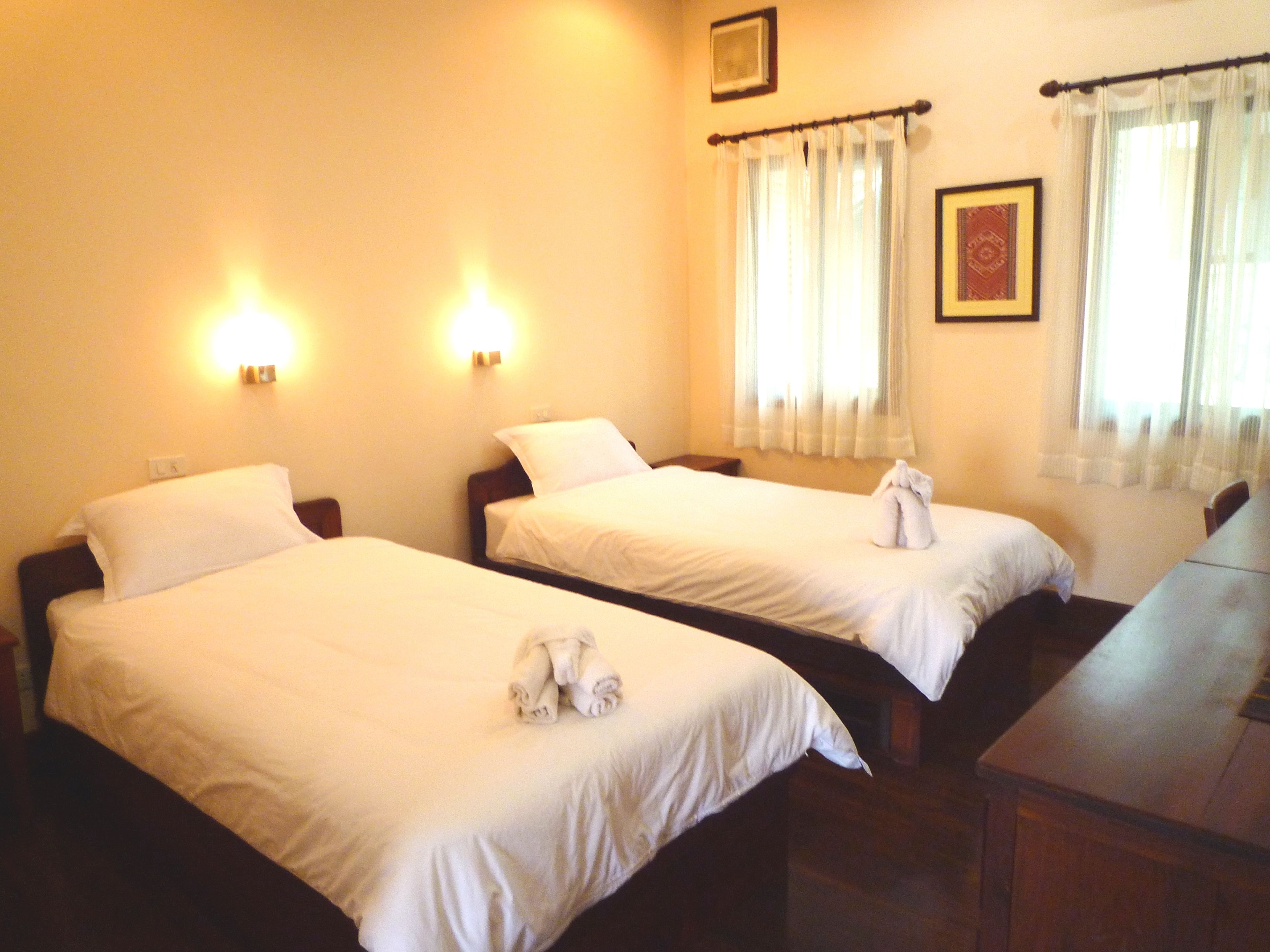 standard twin room, patio | premium bedding, minibar, in-room safe, desk