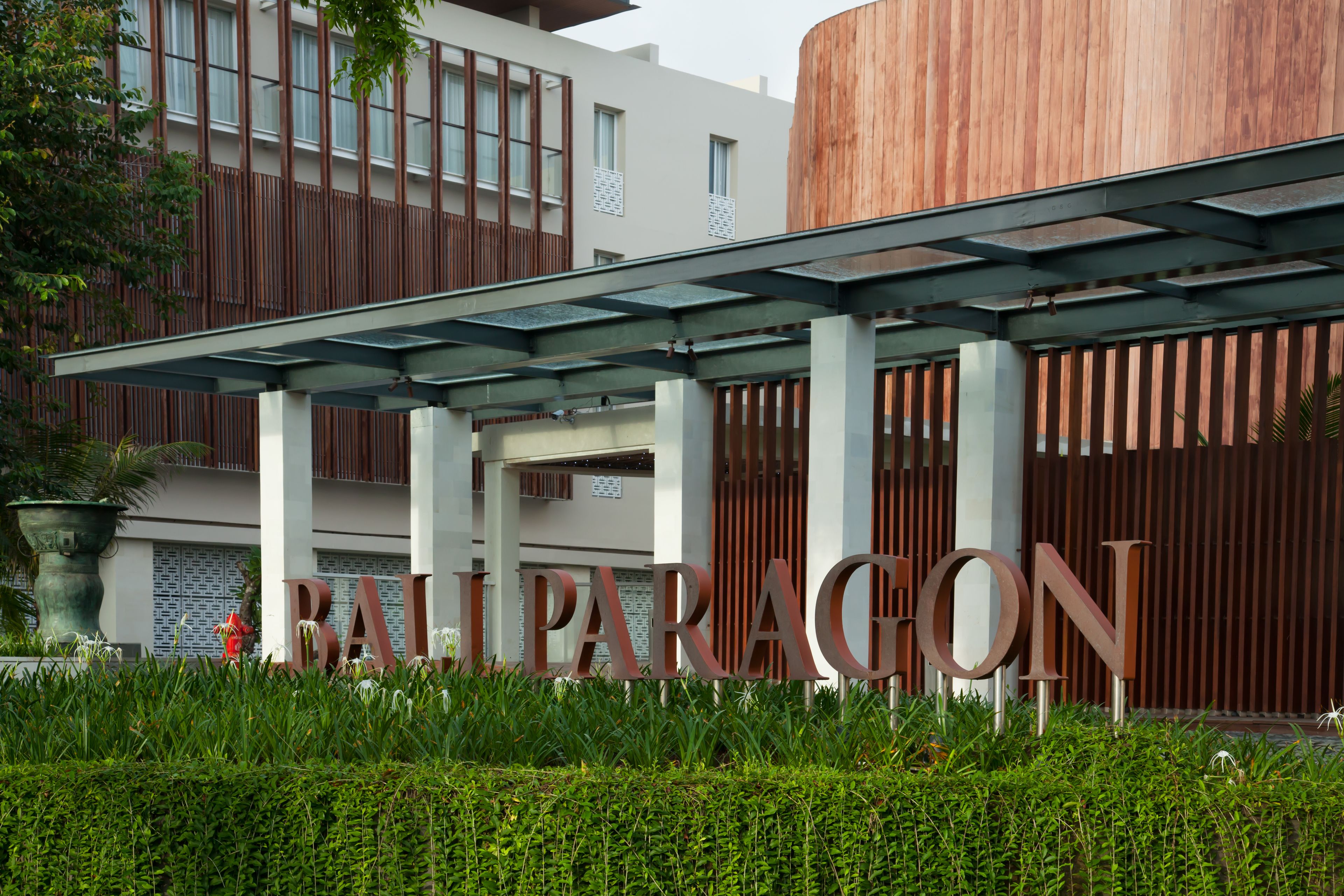 A modern building with a large sign reading "RAIL PARAGON".