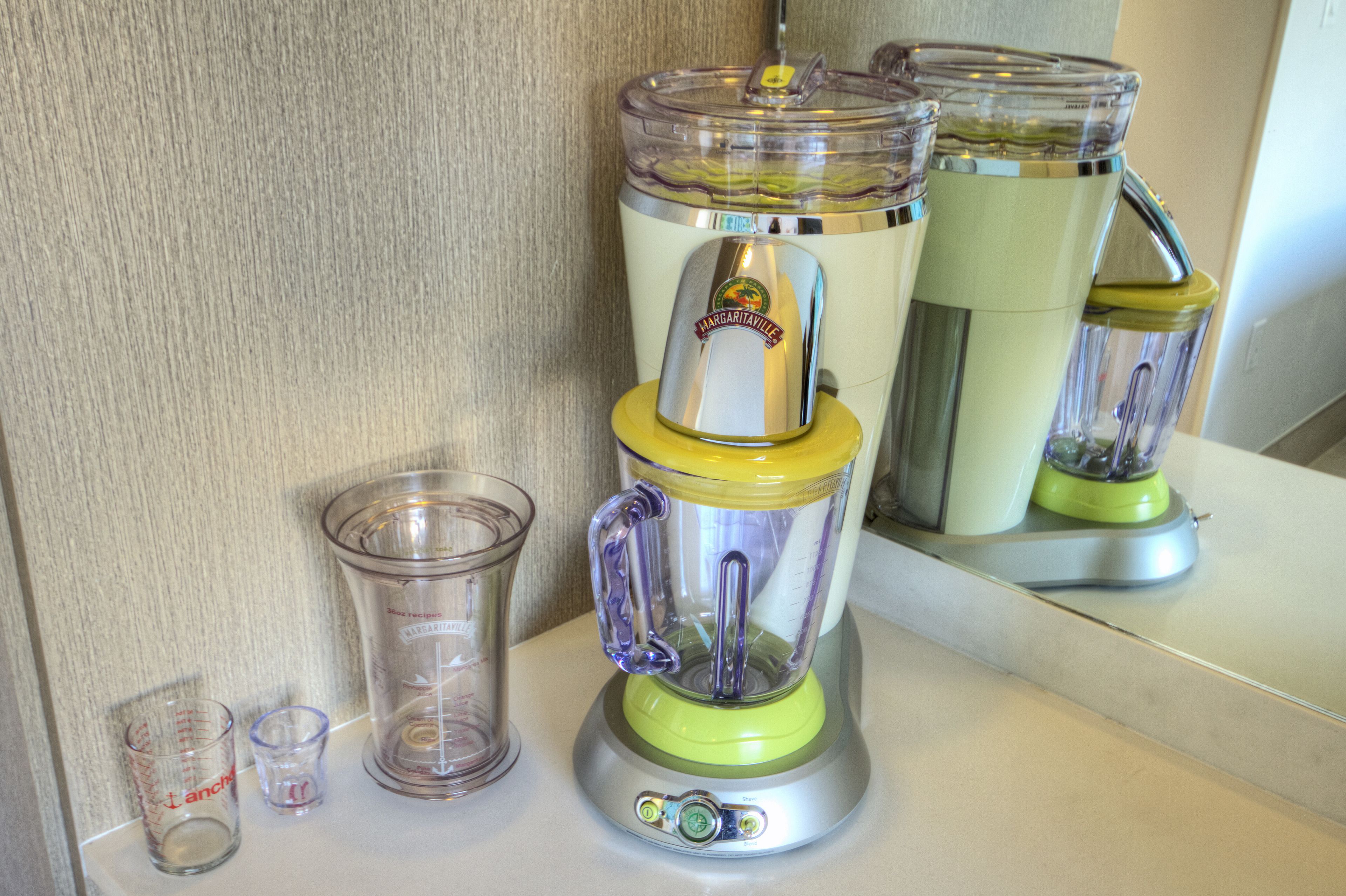 A kitchen with a blender on the counter.