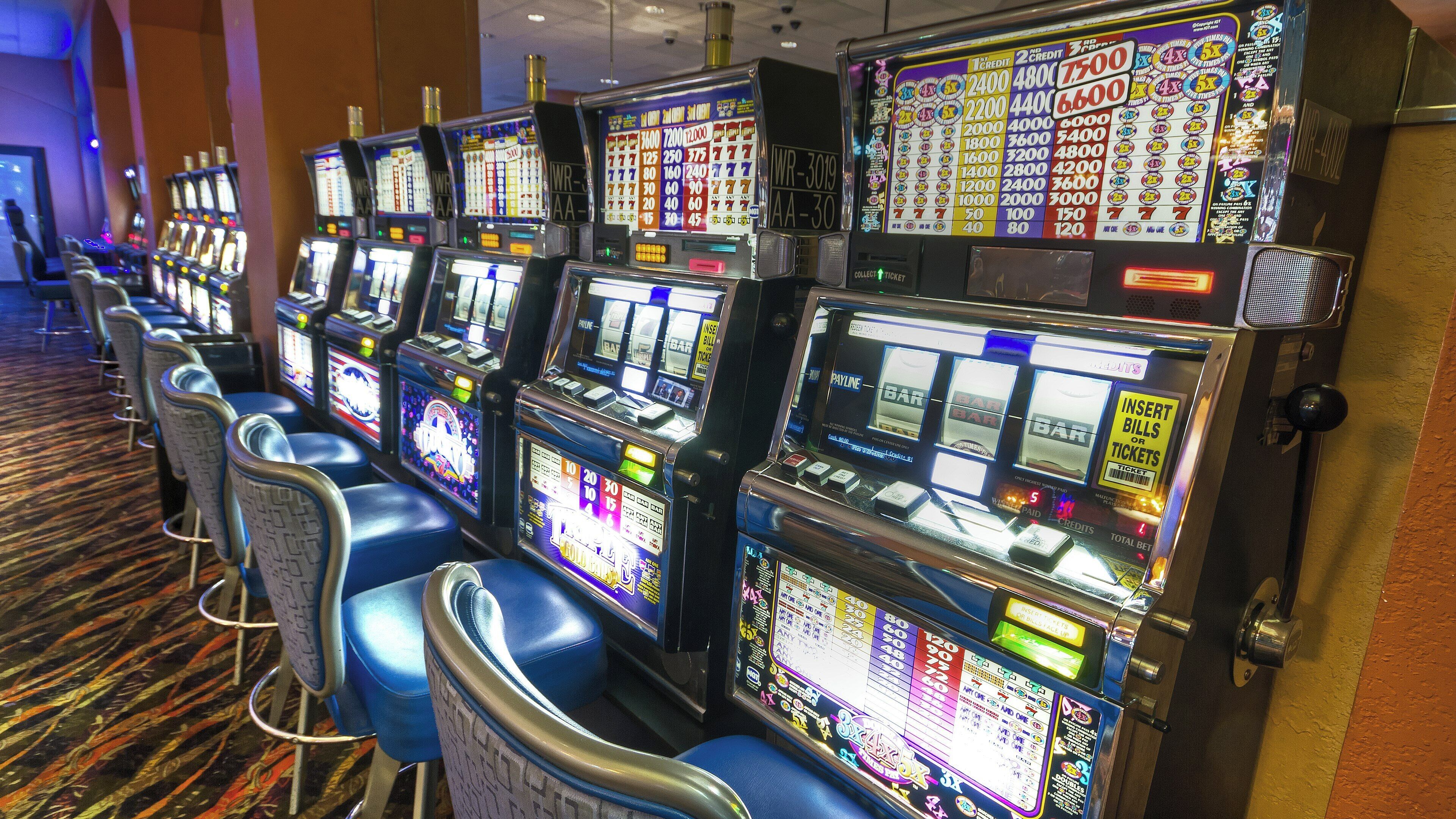 A row of slot machines in a casino.