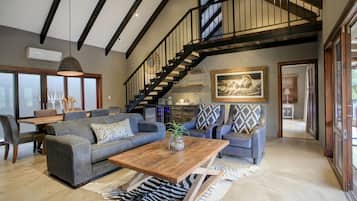 Superior 3 bedroom Self-Catering and pool | Living room | Flat-screen TV, fireplace