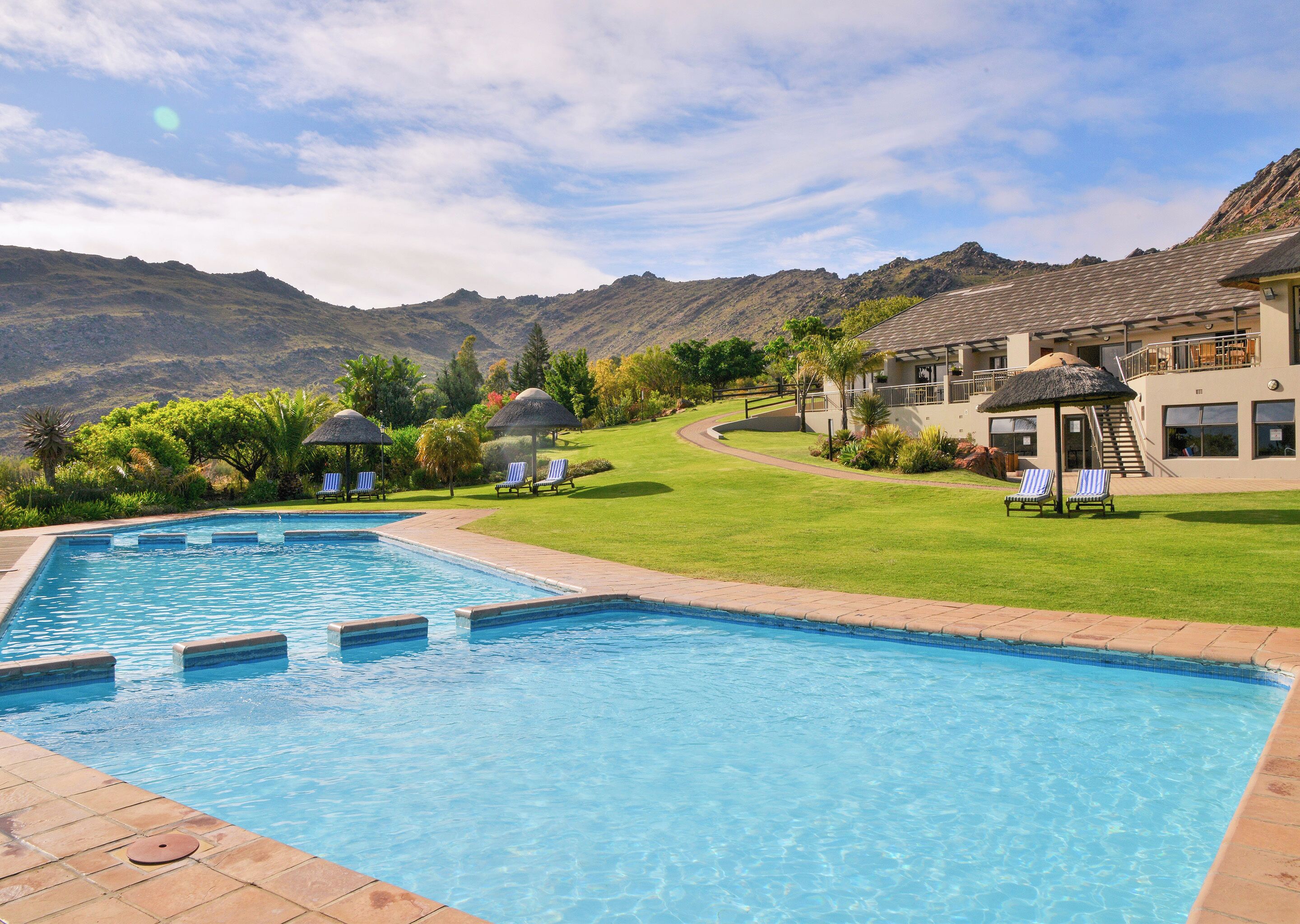 Indoor pool, outdoor pool, pool umbrellas, sun loungers