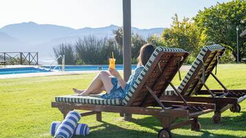 Indoor pool, outdoor pool, pool umbrellas, pool loungers