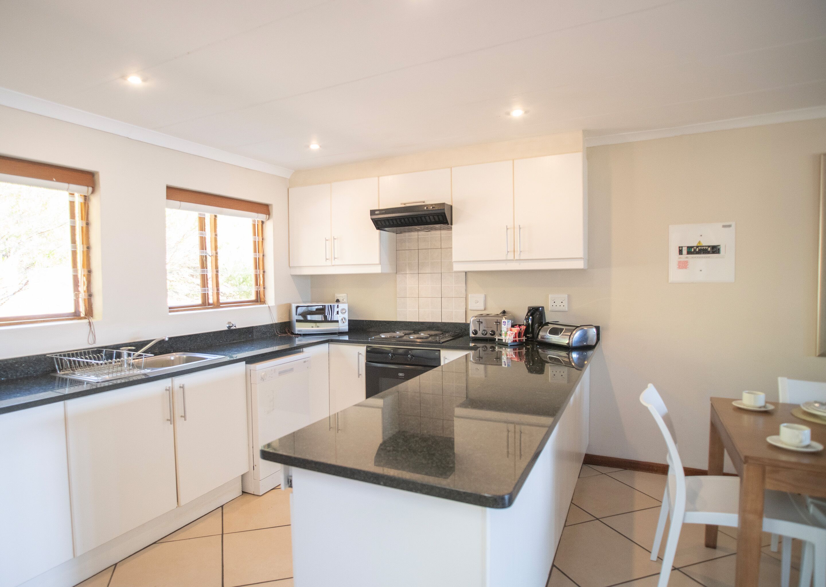 coffee/tea maker, electric kettle, dining tables