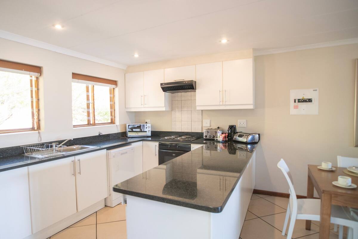 coffee/tea maker, electric kettle, dining tables