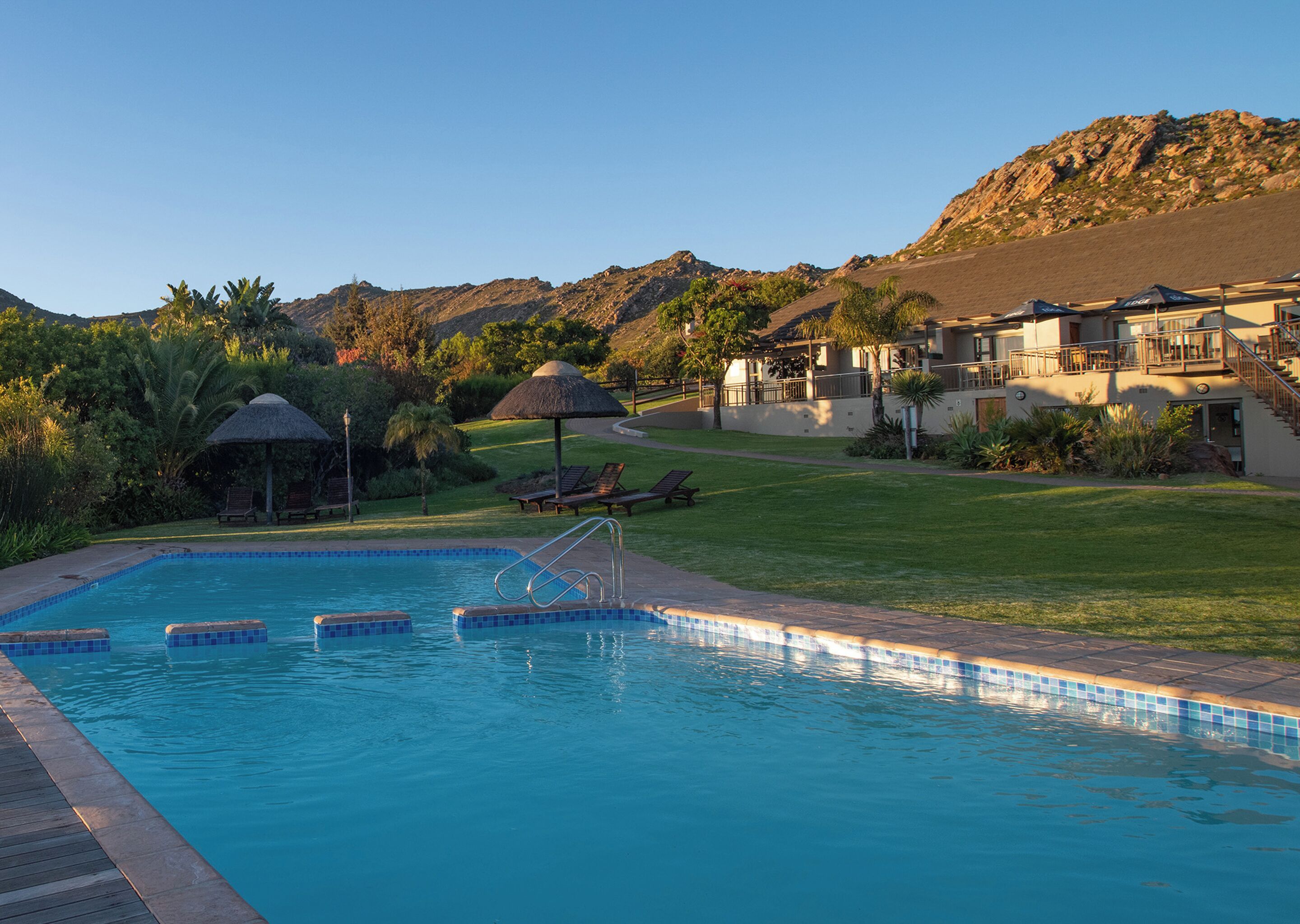 Indoor pool, outdoor pool, pool umbrellas, sun loungers