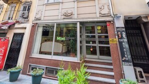 A multi-story building with a ground-floor shop named 'Mint Residence'. - Mint Residence Taksim (Istanbul)