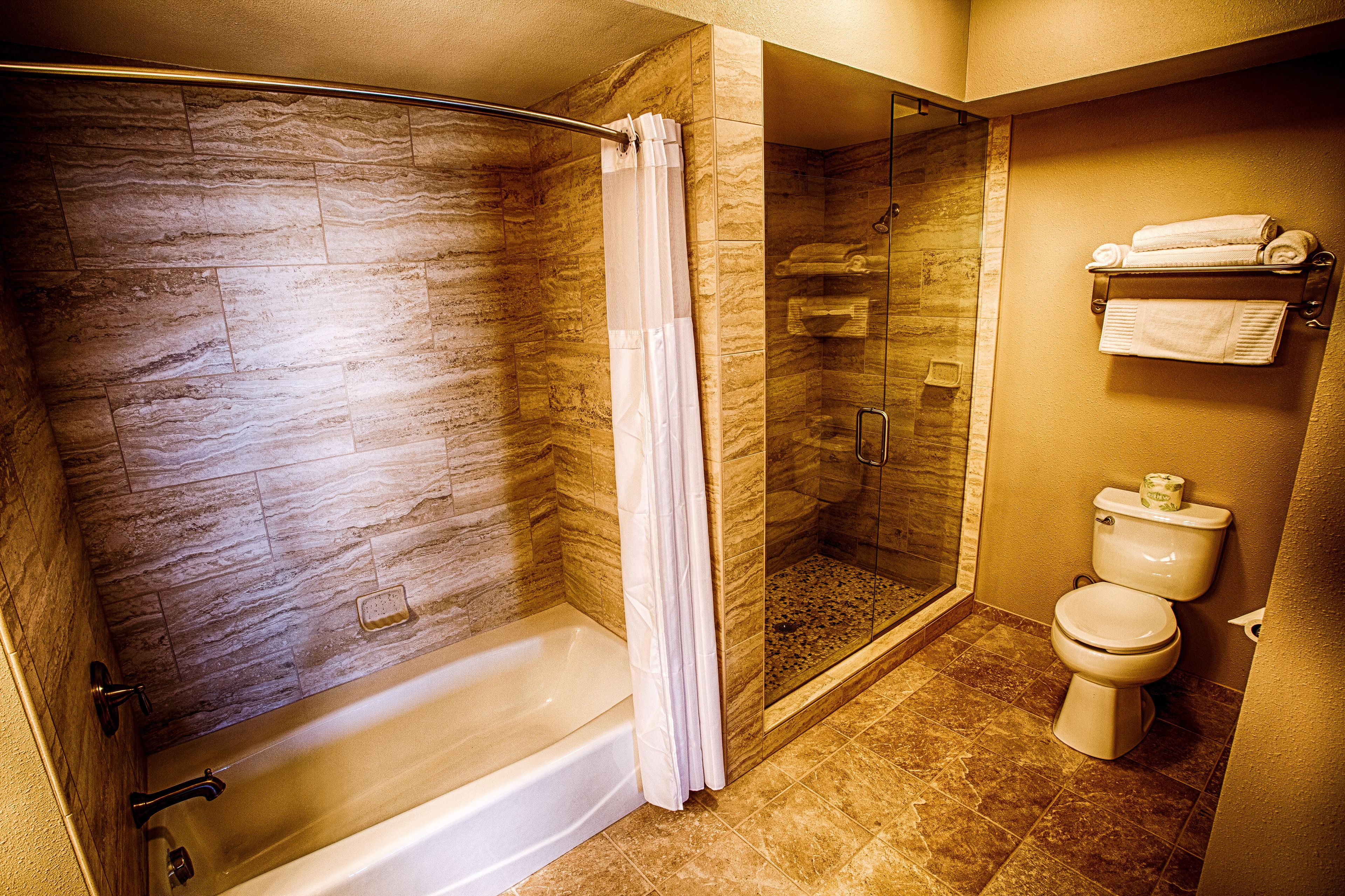 suite, balcony, partial ocean view | bathroom | hair dryer, towels, soap, shampoo