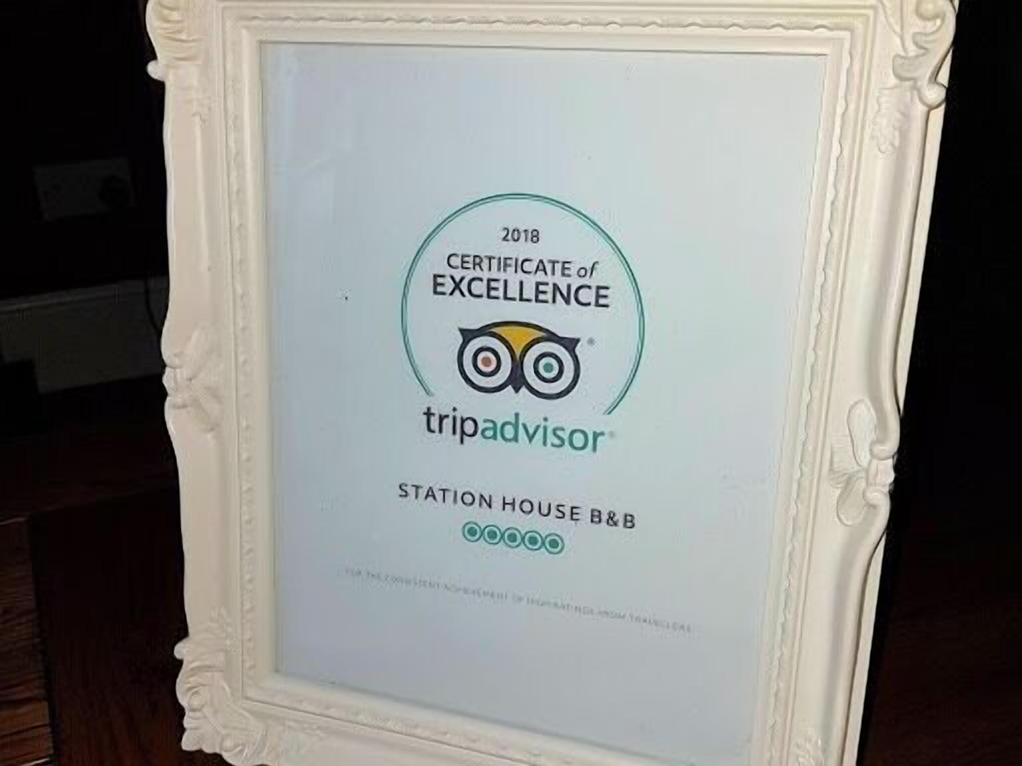 A framed certificate of excellence from TripAdvisor for Station House B&B, dated 2018.