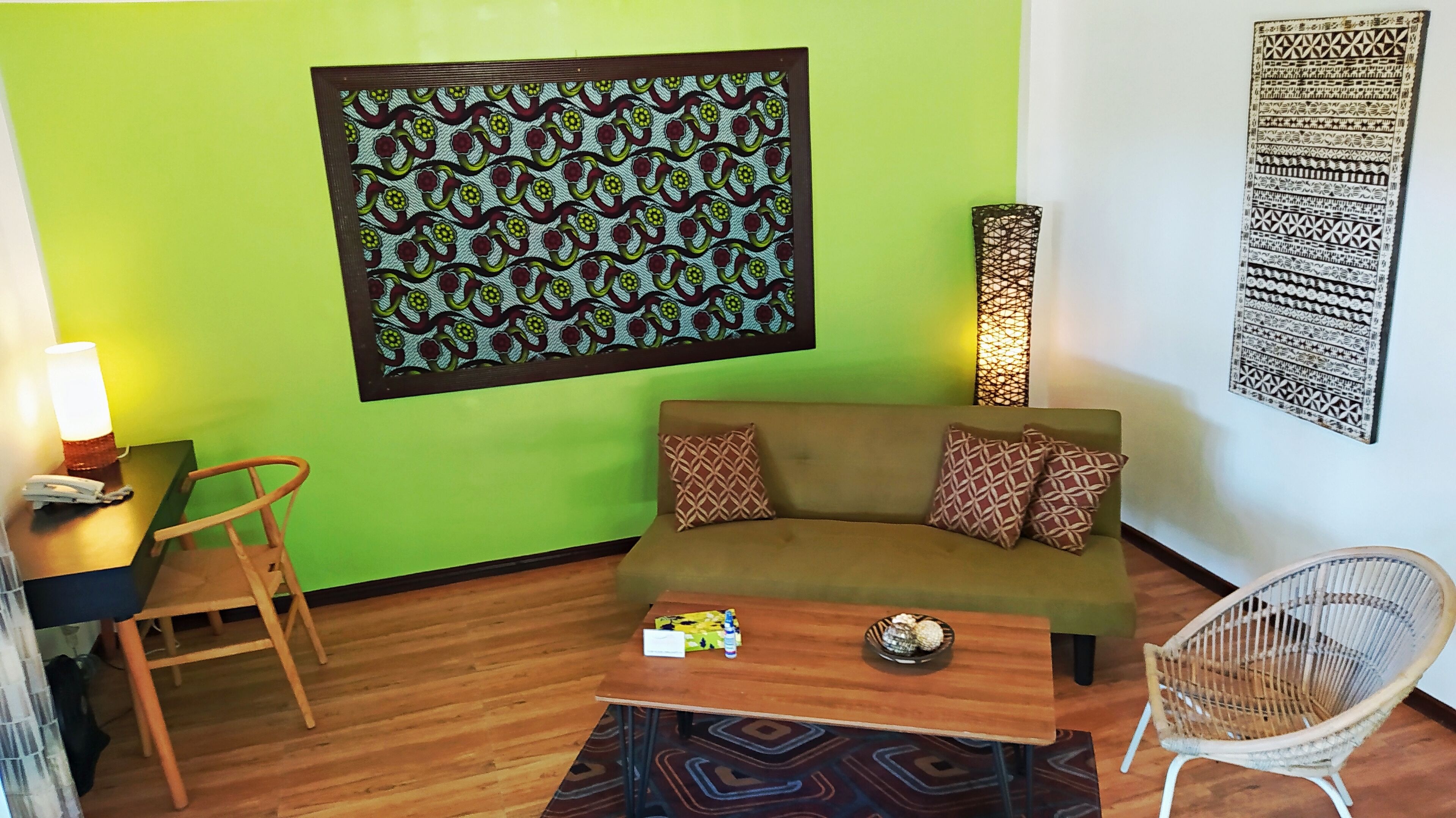 deluxe villa (beach front) | living area | flat-screen tv