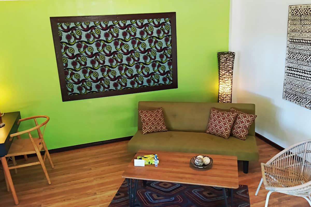 deluxe villa (beach front) | living area | flat-screen tv