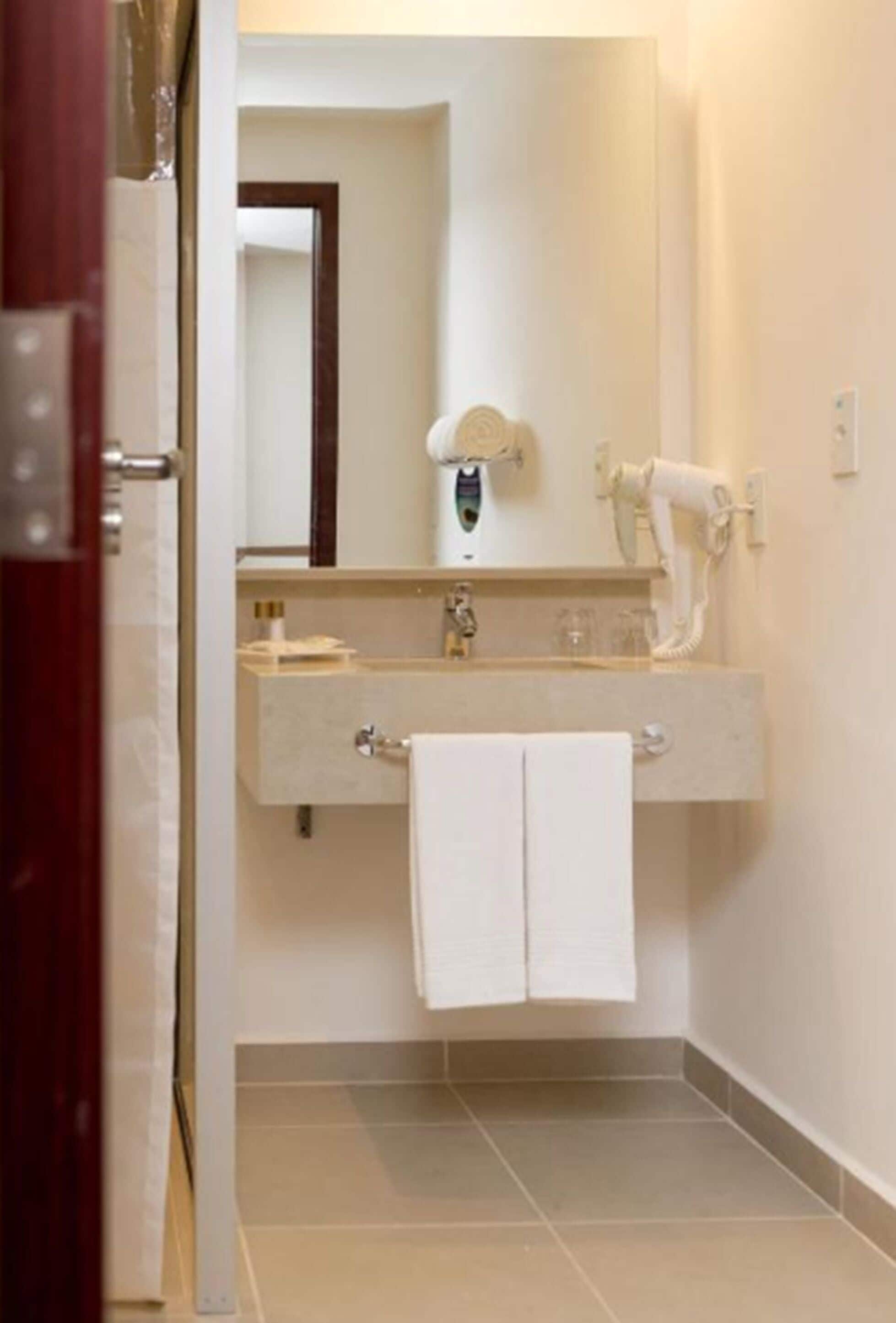 shower, eco-friendly toiletries, hair dryer, towels