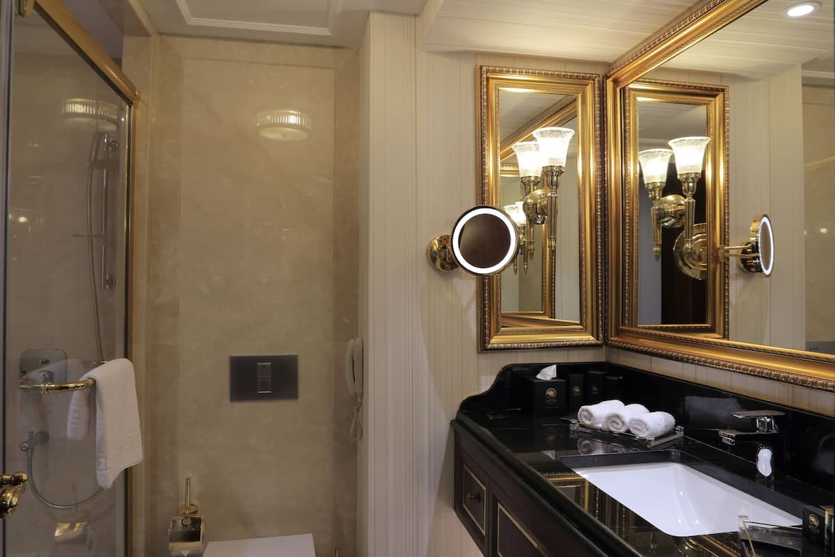 superior room | bathroom | shower, designer toiletries, hair dryer, bathrobes