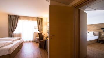 Familjesvit - anslutande rum | Sängtillbehör av högsta kvalitet och duntäcken