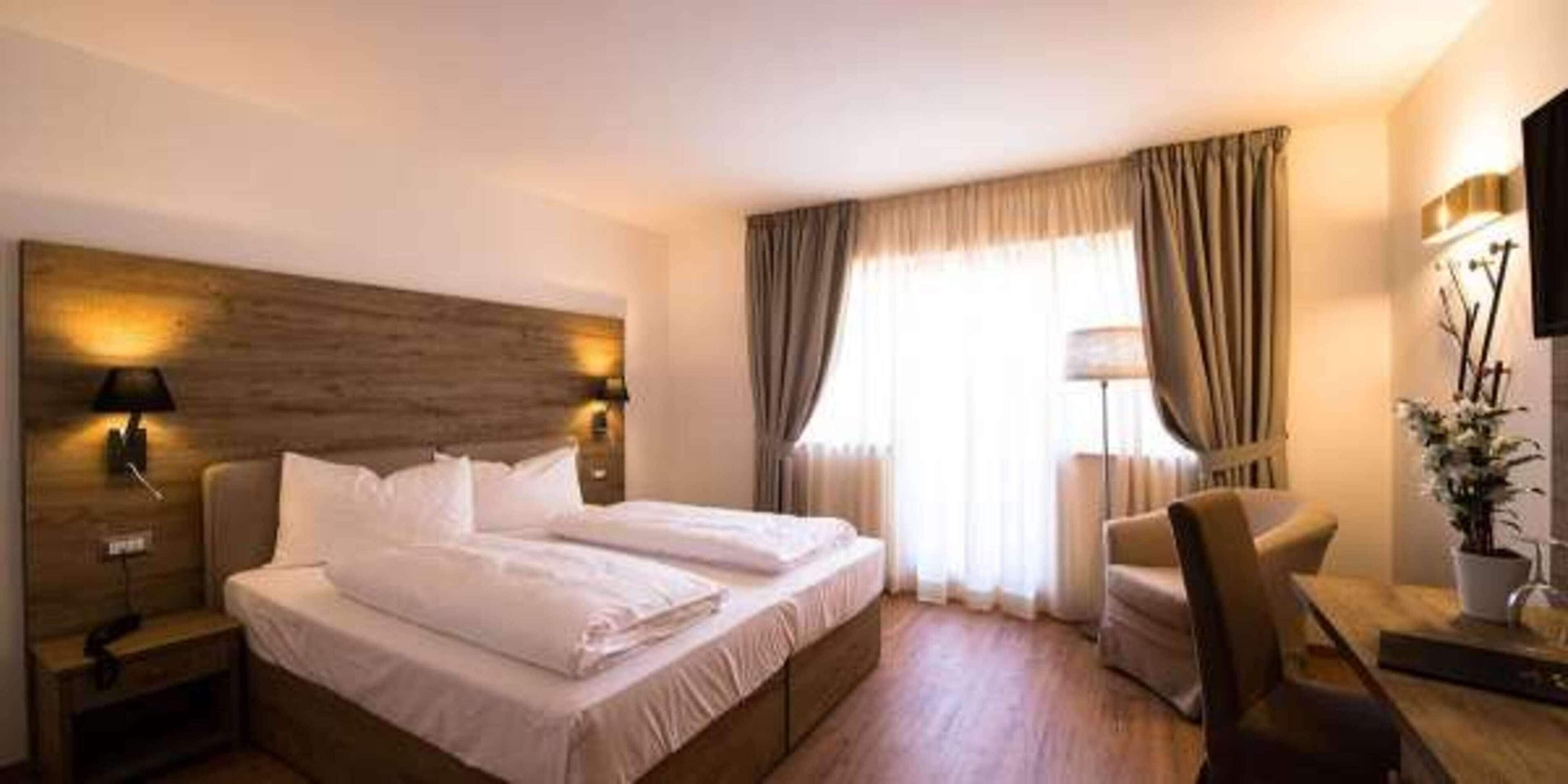 Premium bedding, down duvets, in-room safe, desk