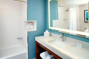 Designer toiletries, hair dryer, towels