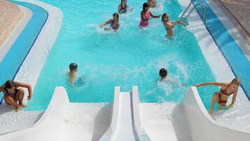 Enjoy swimming and playing in the central pool surrounded by water features and slides.