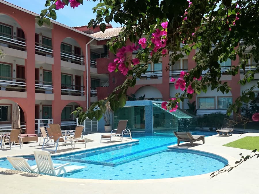 Outdoor pool, open 9:00 AM to 9:00 PM, pool umbrellas, pool loungers