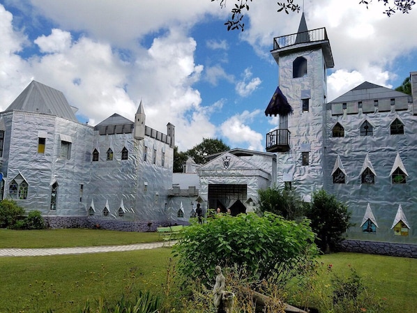 A castle-like building with multiple towers and a central entrance.