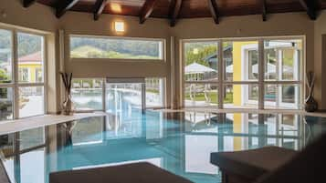 Indoor pool, pool umbrellas, pool loungers