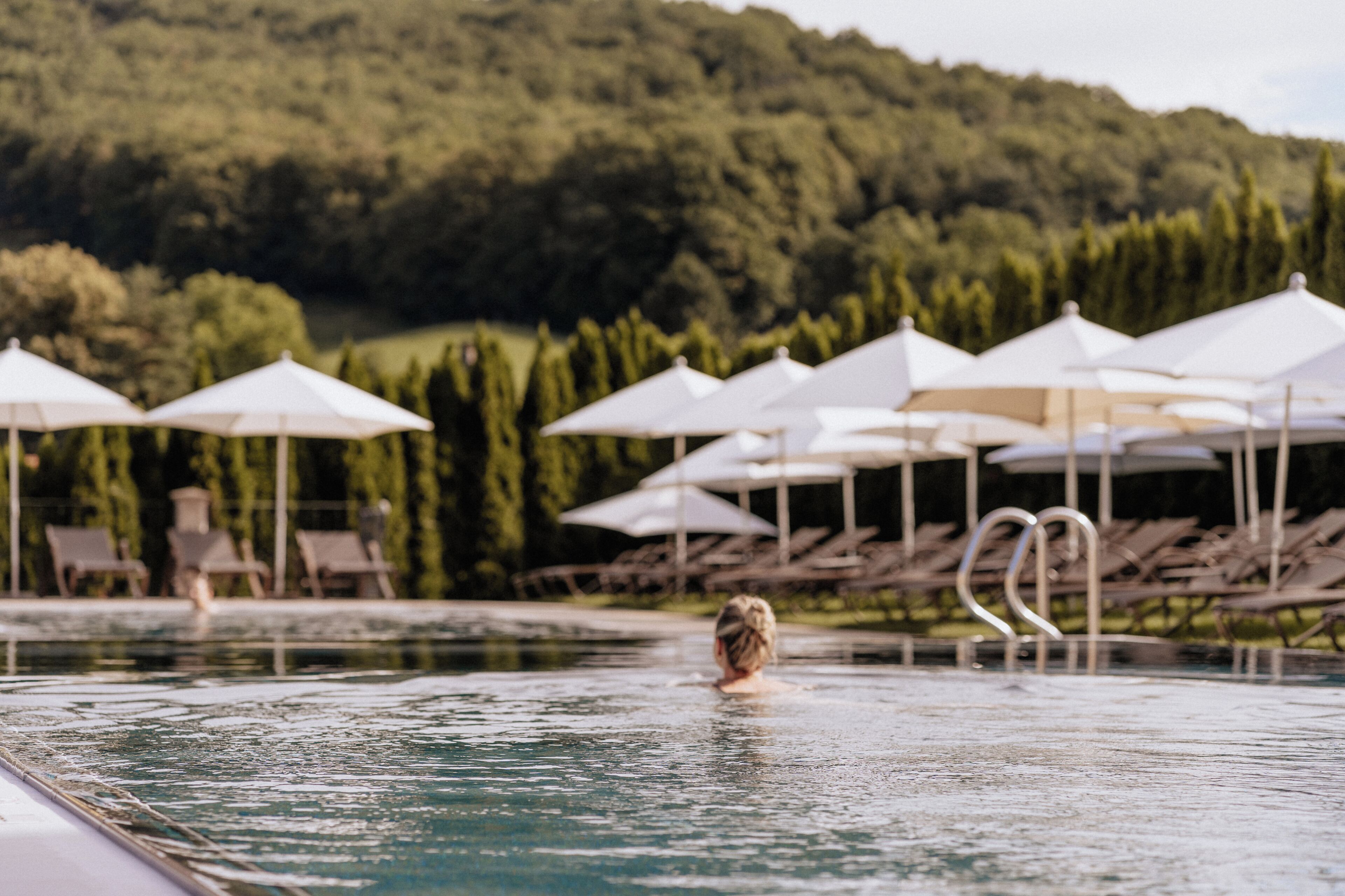 indoor pool, 2 outdoor pools, open 10:00 am to 7:00 pm, pool umbrellas