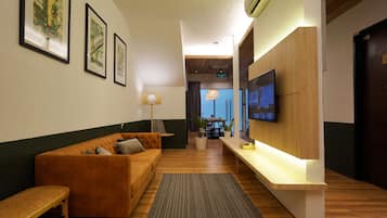 Deluxe Apartment, 3 Bedrooms | Living room | 24-inch flat-screen TV with cable channels, TV