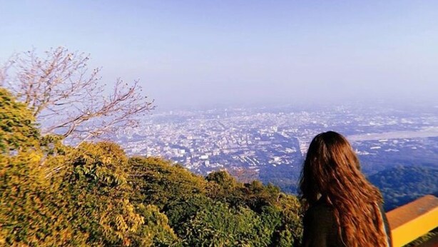 A person overlooking a cityscape from a high vantage point. - Gusto House (Chiang Mai)