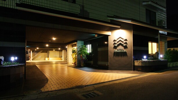 A hotel entrance with a tiled pathway leading to the door, a sign with the hotel name, and a staircase to the left. - Hotel Pagoda (Nara)