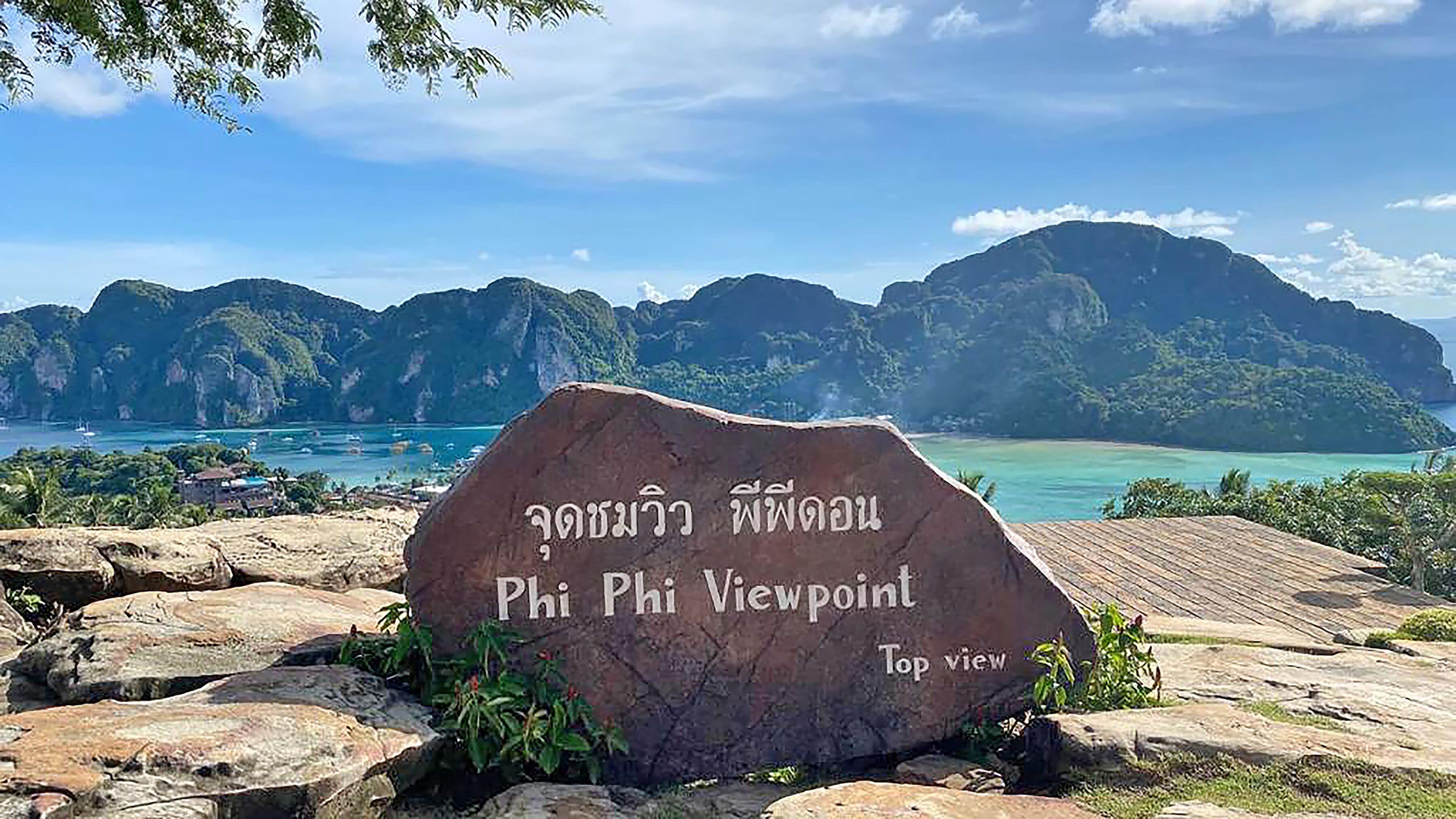 A stone sign with Thai text reading "Phi Phi Viewpoint Top view".