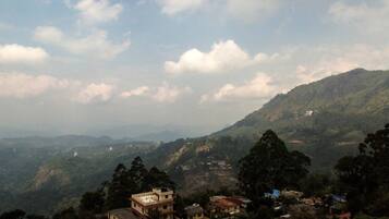 A mountainous landscape with scattered buildings.
