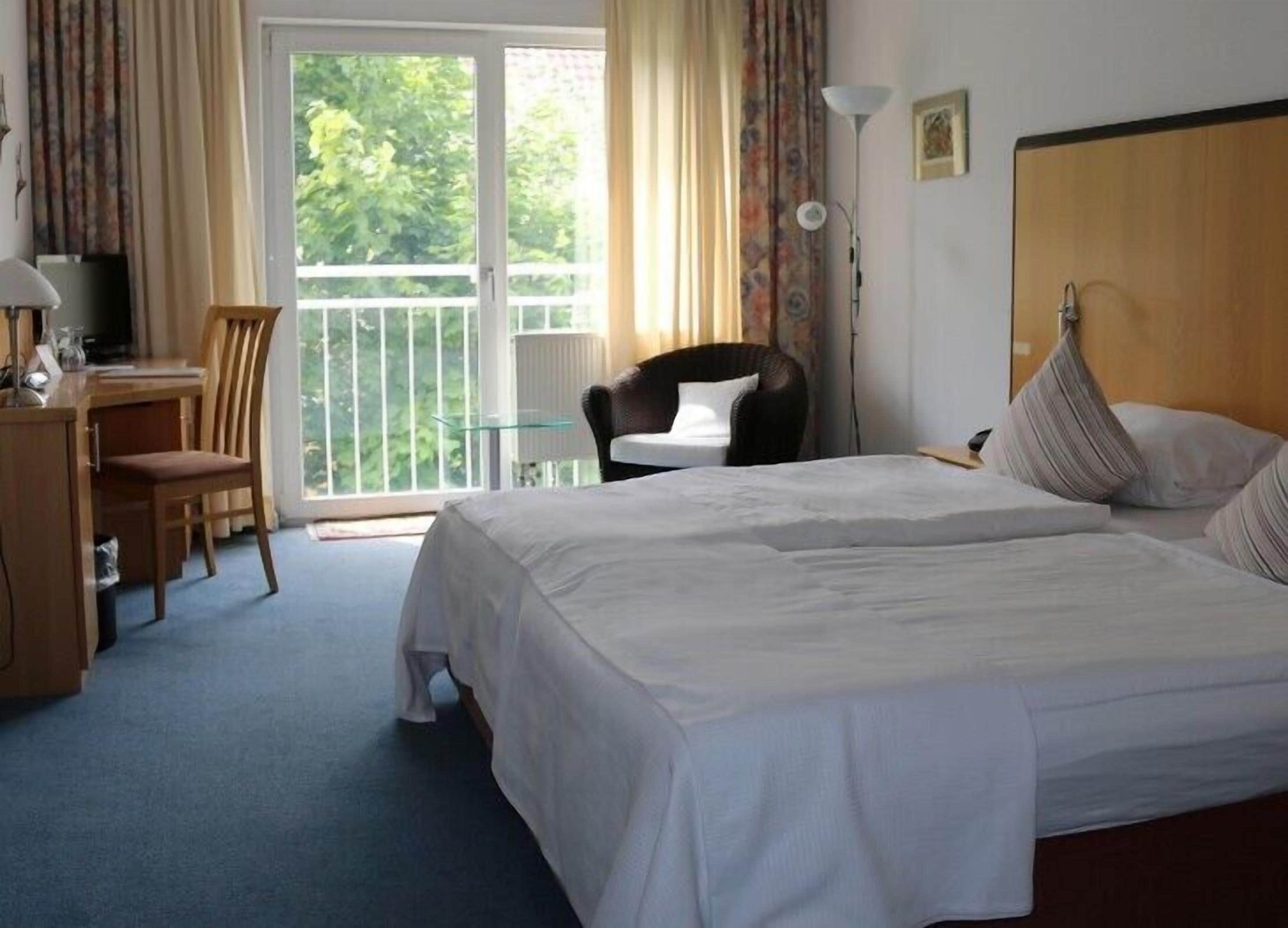 premium bedding, minibar, desk, laptop workspace