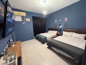 Habitación cuádruple familiar | 4 habitaciones, ropa de cama de alta calidad y decoración personalizada