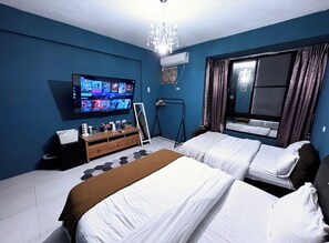 Habitación cuádruple familiar | 4 habitaciones, ropa de cama de alta calidad y decoración personalizada