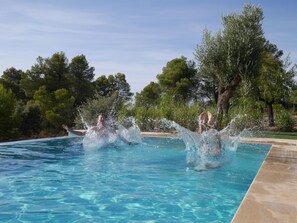 Seasonal outdoor pool, an infinity pool, pool loungers
