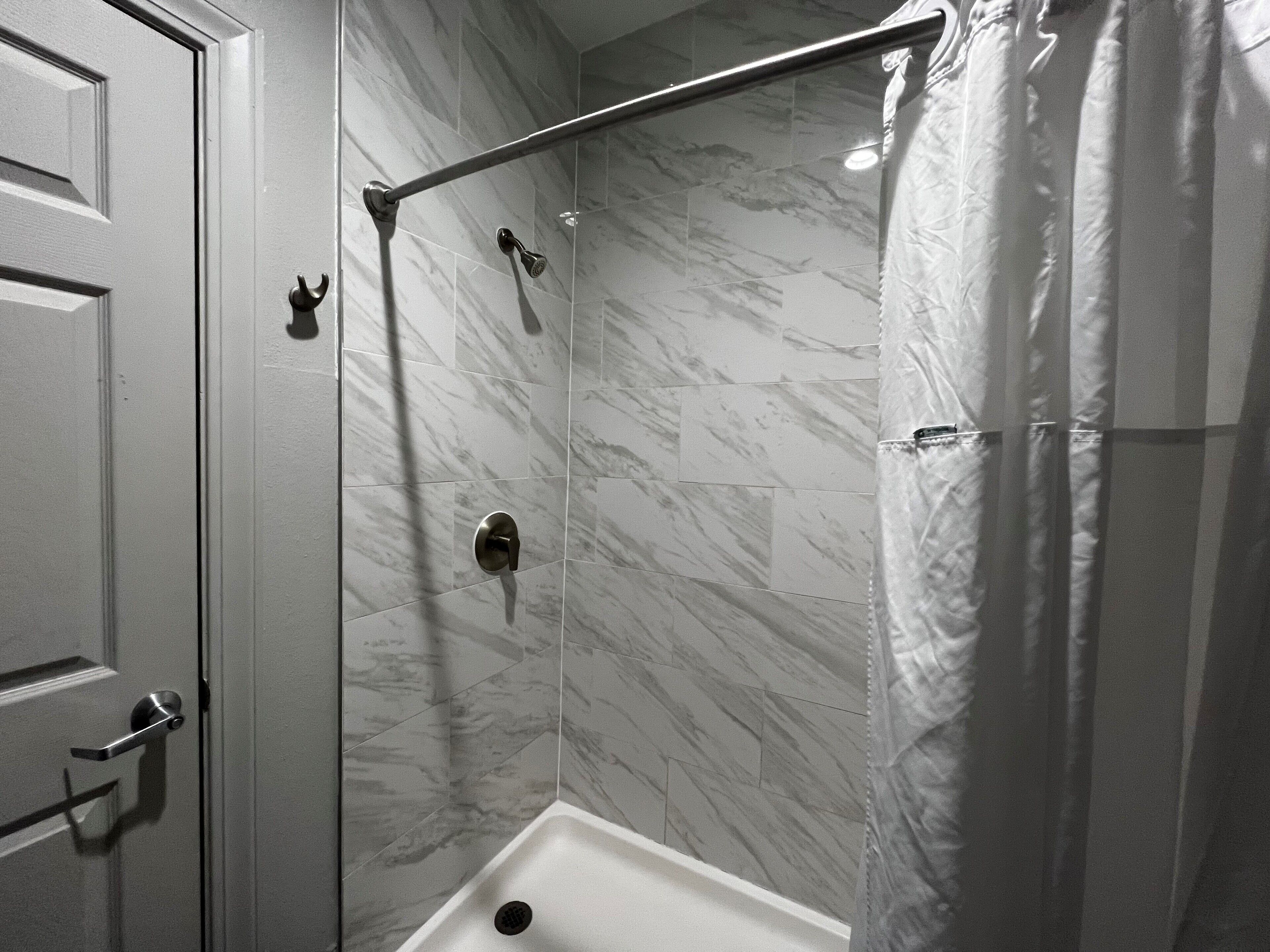 bathtub, rainfall showerhead, free toiletries, hair dryer