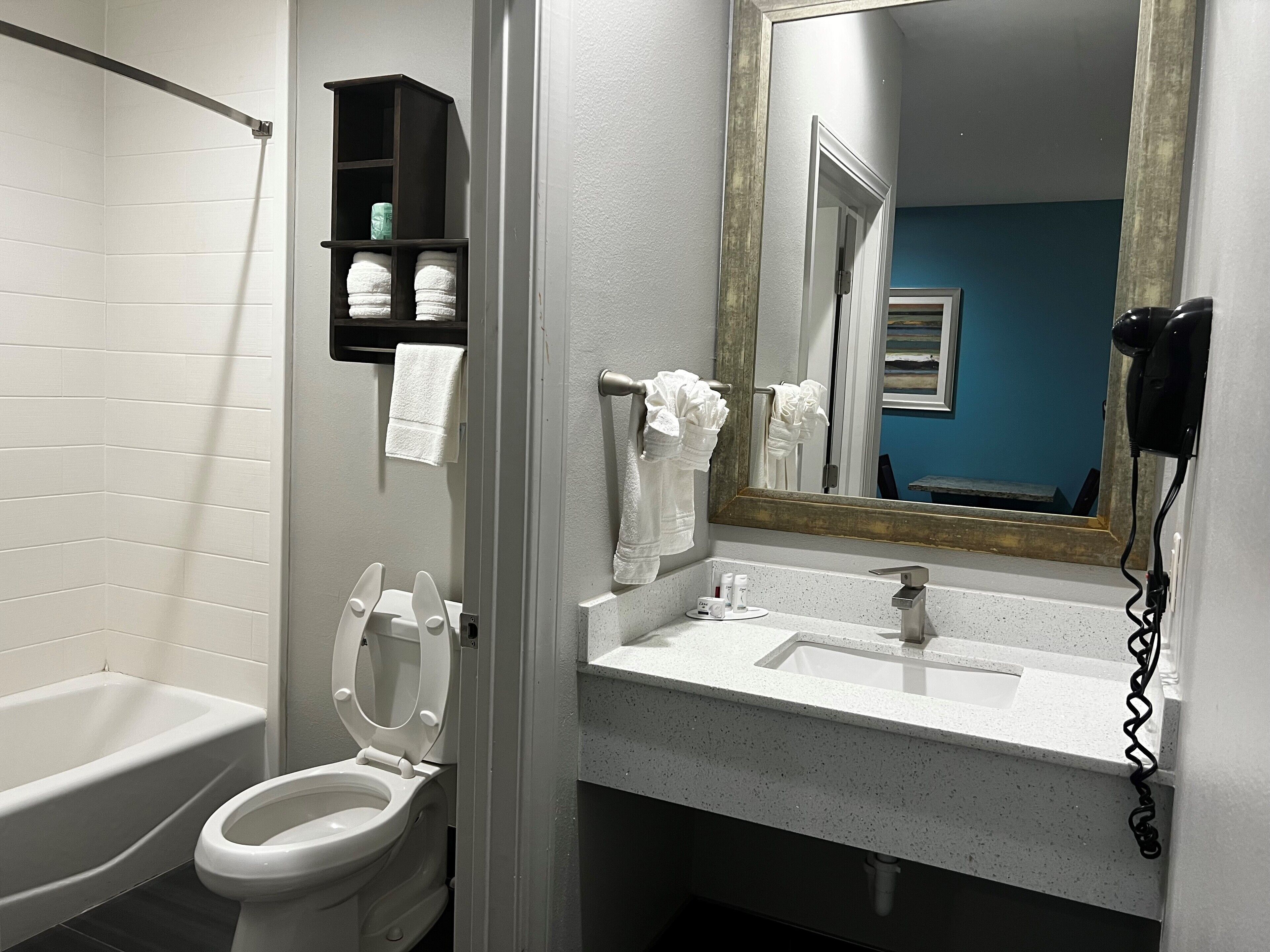 bathtub, rainfall showerhead, free toiletries, hair dryer