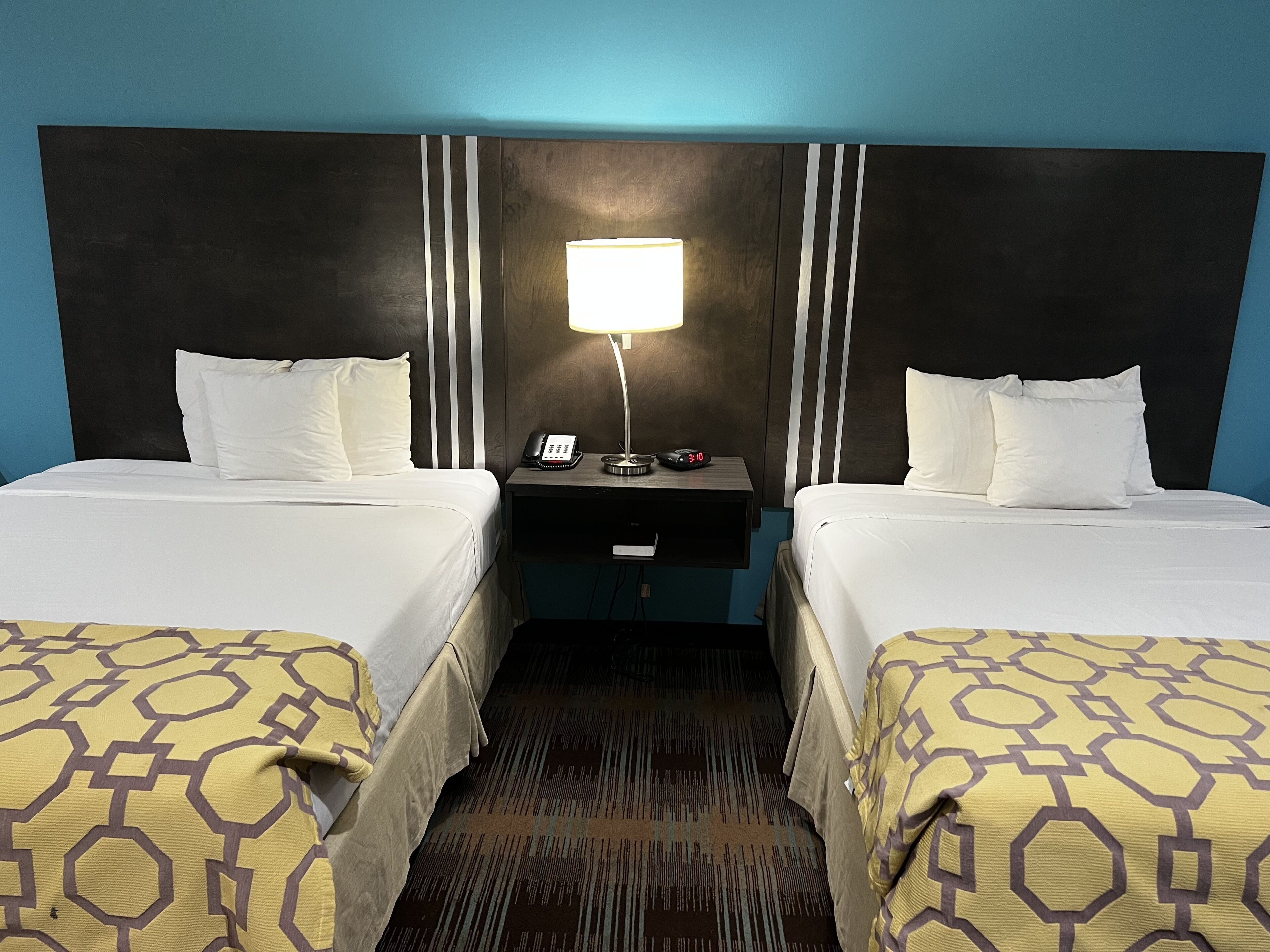 premium bedding, pillow-top beds, desk, blackout curtains