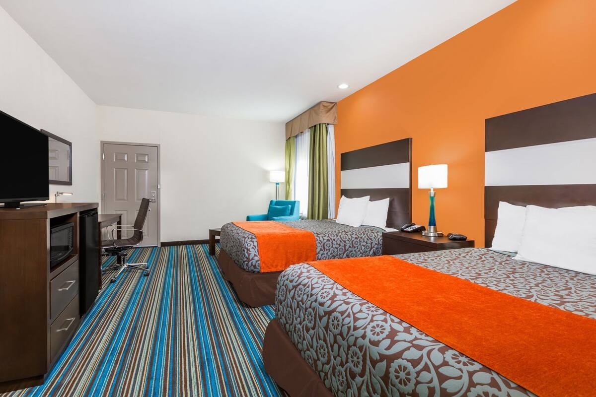 Premium bedding, desk, laptop workspace, iron/ironing board