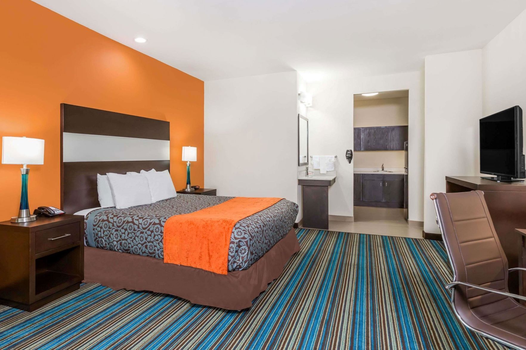Premium bedding, desk, laptop workspace, iron/ironing board