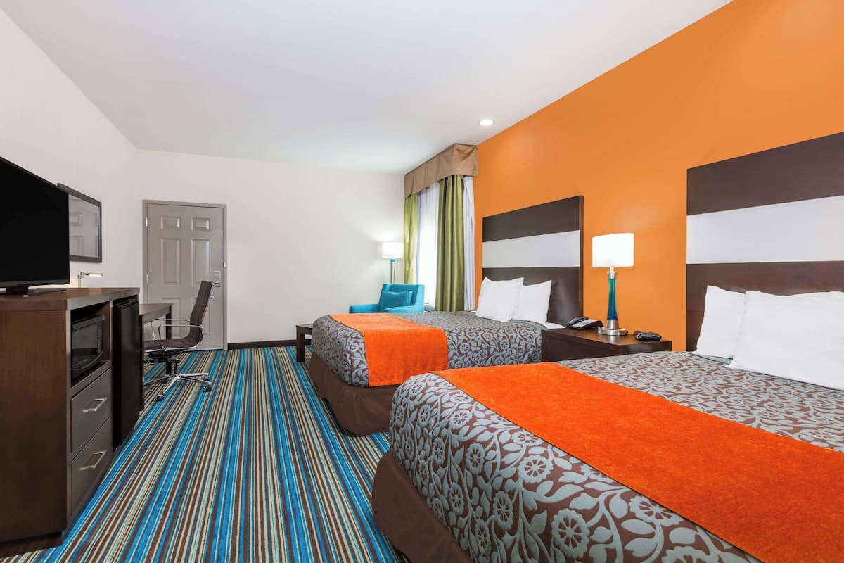 Premium bedding, desk, laptop workspace, iron/ironing board