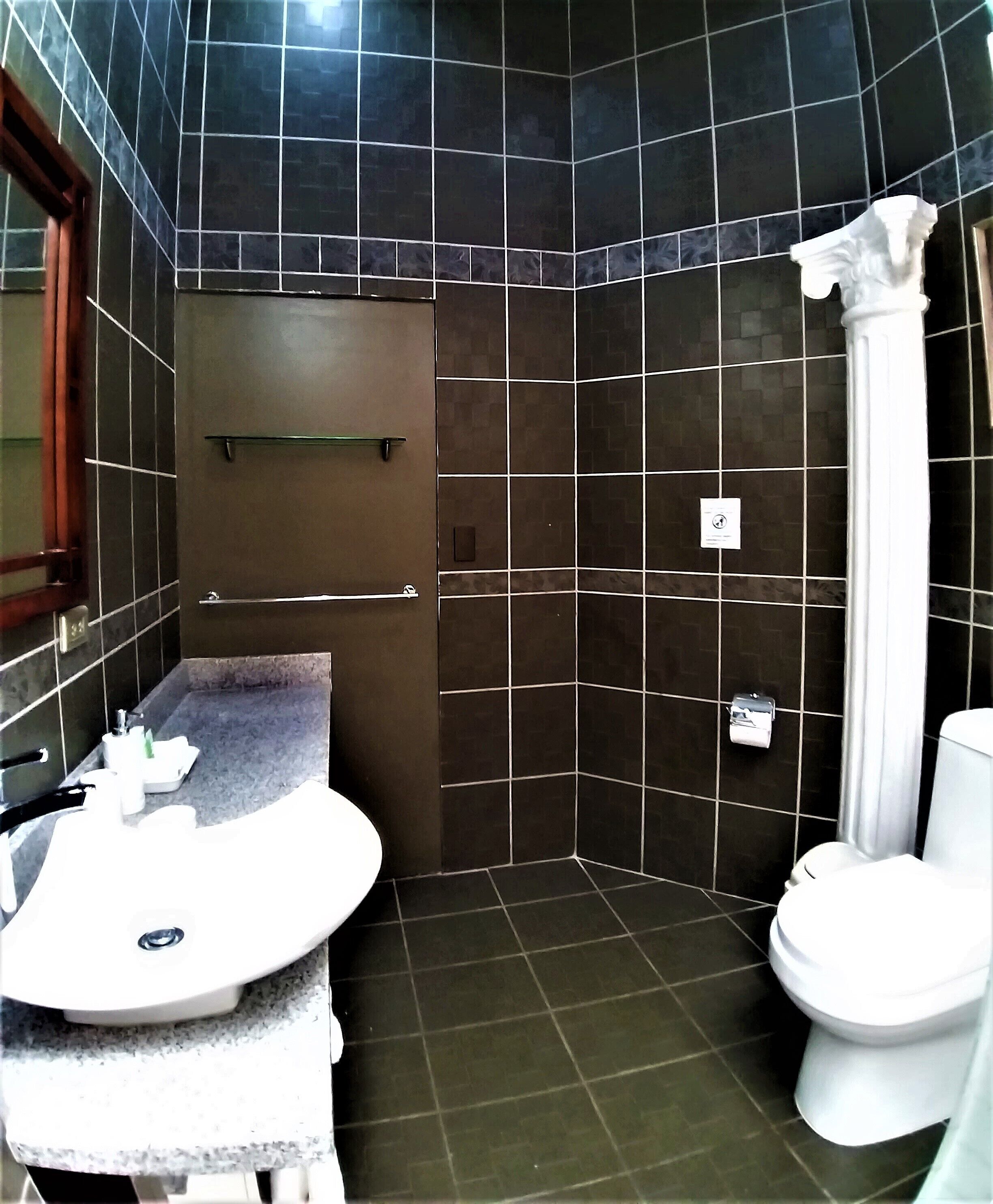 deluxe double room | bathroom | designer toiletries, hair dryer, towels