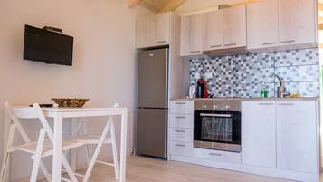 Deluxe Apartment, 1 Bedroom | Private kitchen | Fridge, oven, stovetop, espresso maker