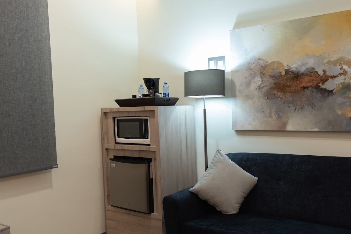 junior suite | in-room safe, desk, soundproofing, iron/ironing board